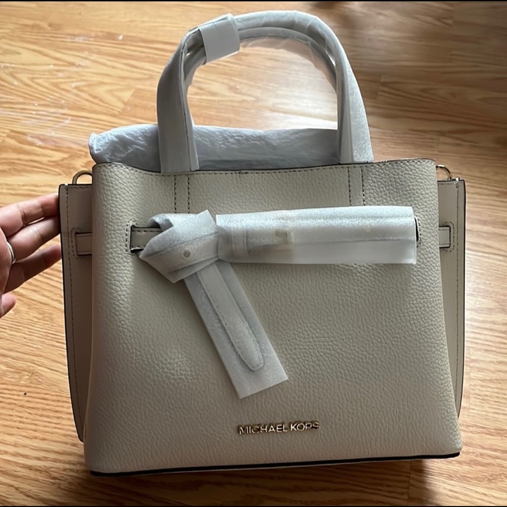 cream Michael Kors hand bag, brand new with tags.